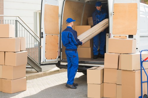 Packed boxes and furniture ready for a local move in Hayes