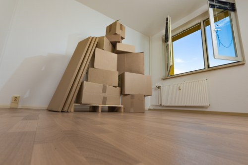 Removal team unloading household items at a new property in Hayes