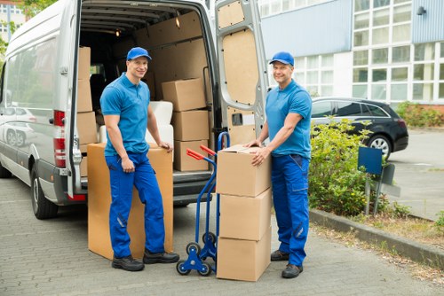 Packed boxes and furniture ready for moving in Hayes