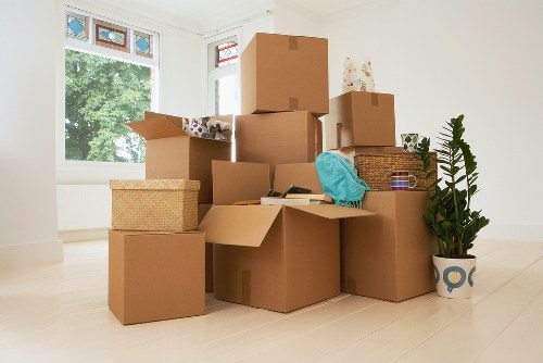 Loading furniture into a moving truck on a residential street in Hayes