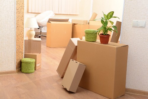 Professional movers loading items from a residential property